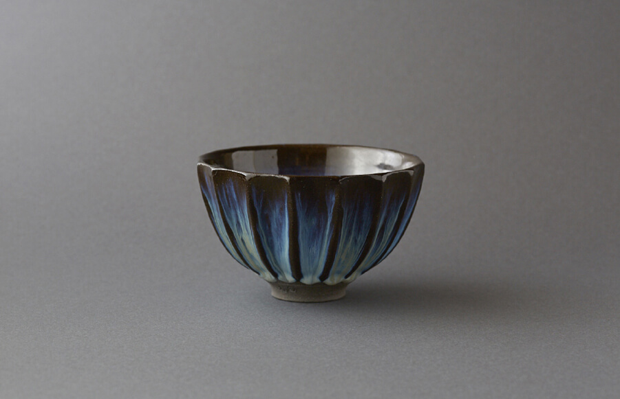 Takatori kyokko (“aurora”)-glazed shinogite (“ridged”)tea bowl (yellow, white, and black glazes)