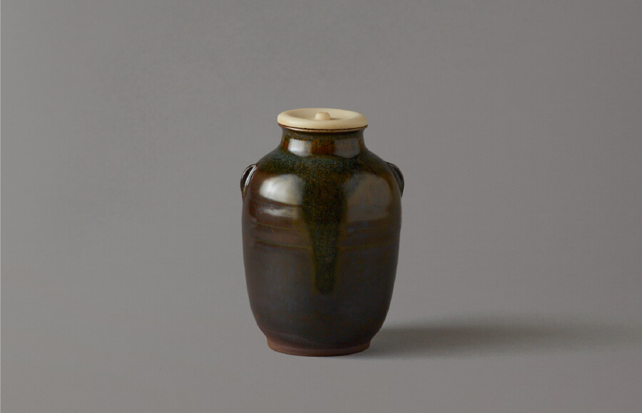 Takatori tea caddy with mimitsuki (“eared”) handles (black over yellow glaze) 